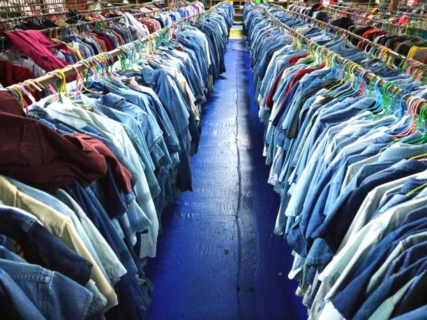 The Secondhand clothes in the market stock photo