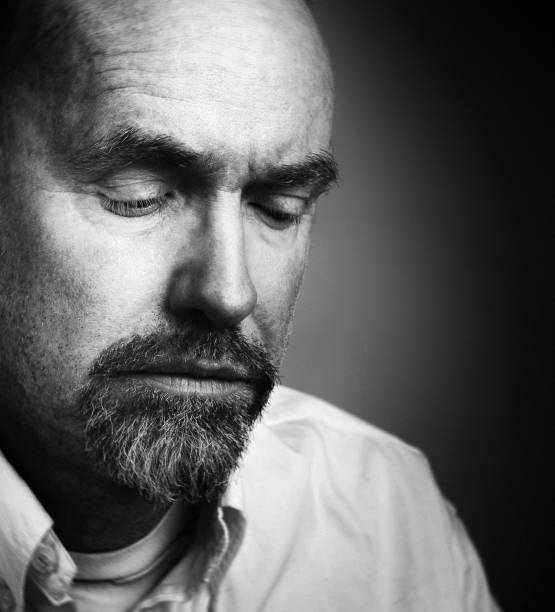 istock Black-and-white portrait of sad, serious, bearded man 825130512