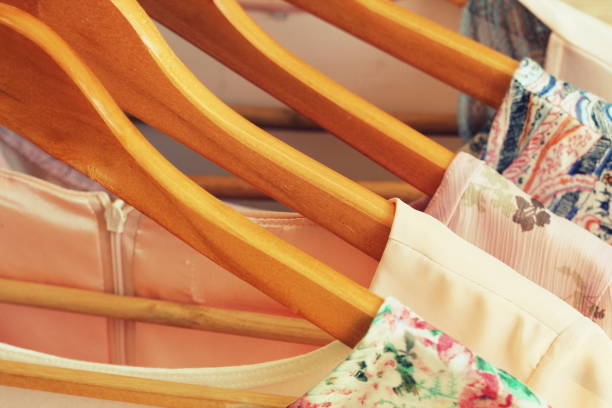 istock collection of women's clothes hanging on rack 825133324