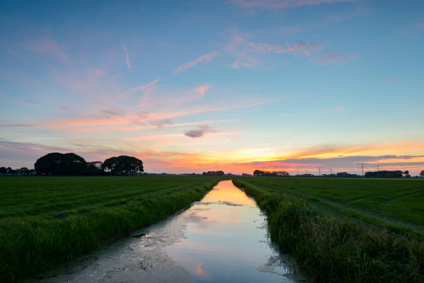 istock Colorful summer sunset over an open landscape 825134828