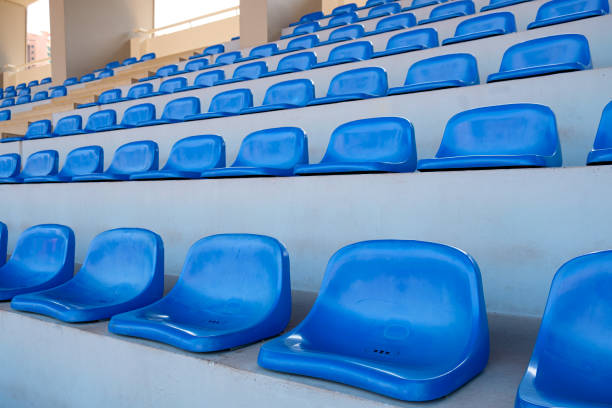 istock Amphitheater of dark blue seats abstract background 825135314