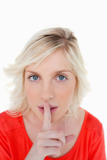 istock Very serious blonde woman telling to be quiet 825135584