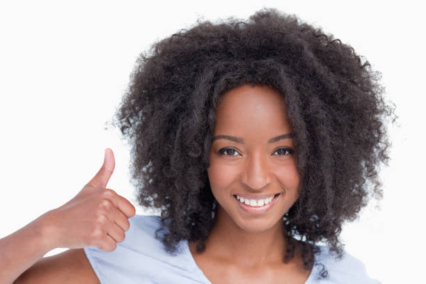 istock Young woman putting her thumbs up 825138494