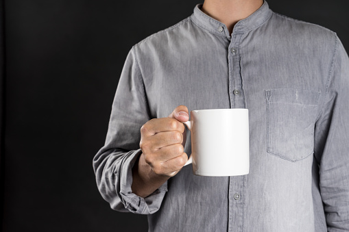 Man holding coffee mug