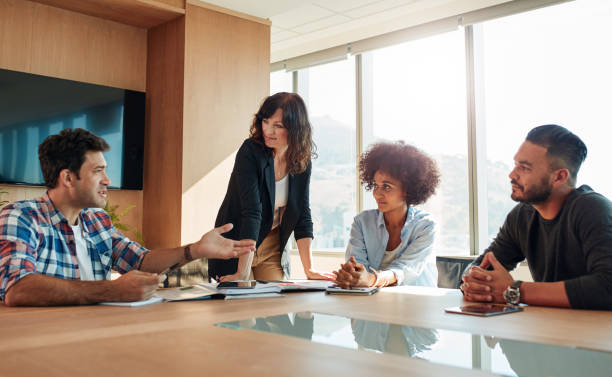 istock Young creative business people in a meeting 825142156