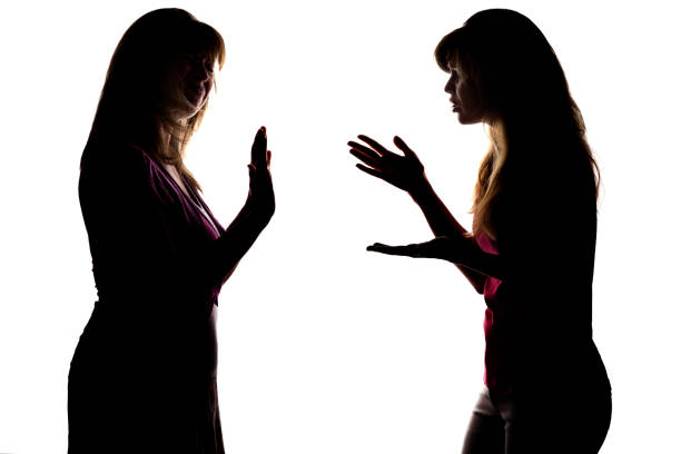 istock Silhouette adolescent begs the parent to allow something, but gets refused 825145188
