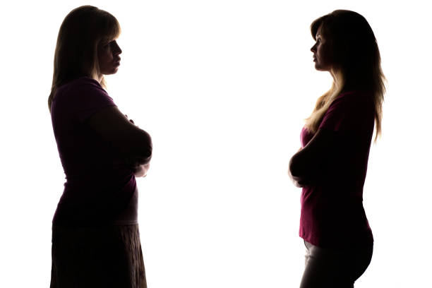 istock Silhouette standing opposite each other daughter and mother 825145504