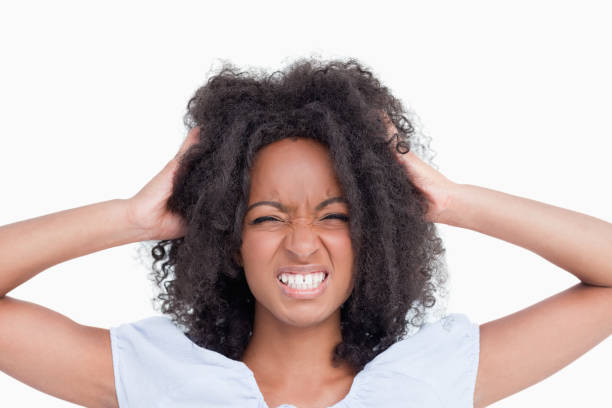 istock Young angry woman holding her head 825148096