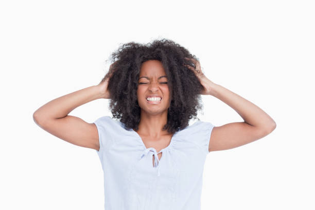 istock Young woman showing her anger by holding her head 825148108
