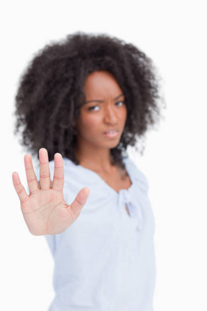 istock Young angry woman making the hand stop sign 825148146