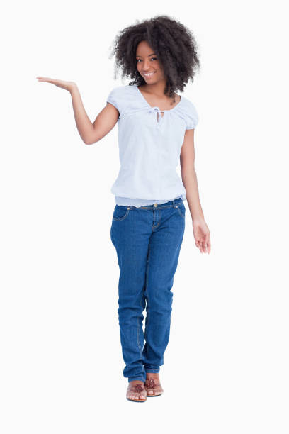 istock Young smiling woman putting her hand palm up 825149166