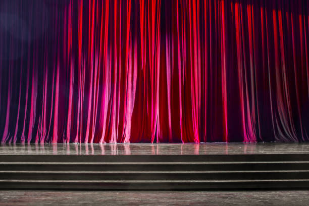 istock Red curtains and wooden stage. 825150940
