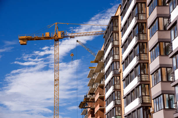 istock apartment building on blue sky background 825168192