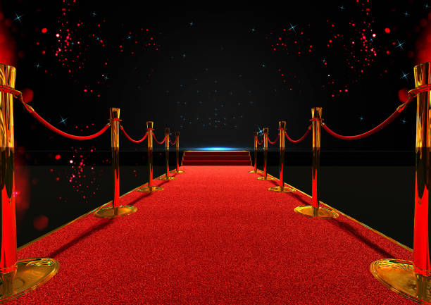 long red carpet between rope barriers with stair at the end