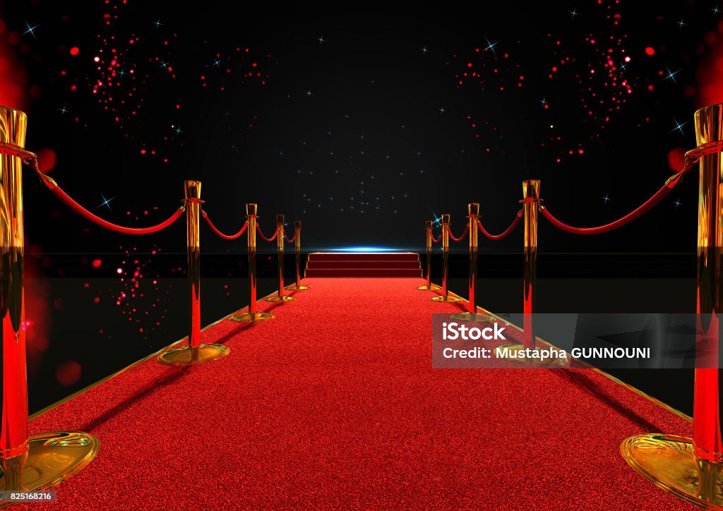 long red carpet between rope barriers with stair at the end Movie Theater Stock Photo