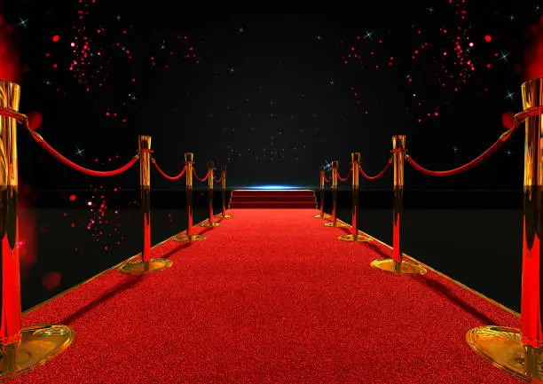 Photo of long red carpet between rope barriers with stair at the end