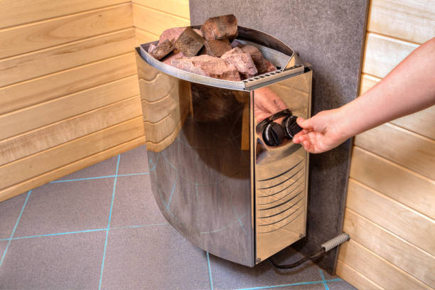 Modern wooden Finnish sauna interior with fresh birch whisk.