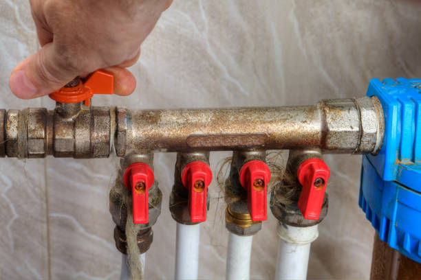 human hand turn off shut-off valve home water supply. - valve imagens e fotografias de stock