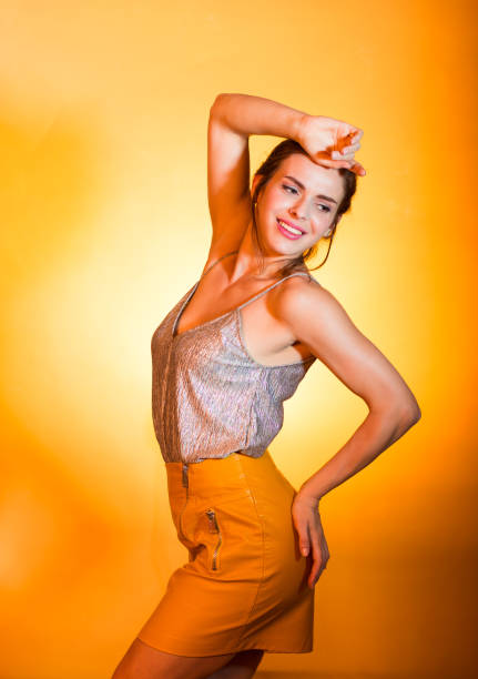 istock Beautiful woman posing in disco lights 825171336
