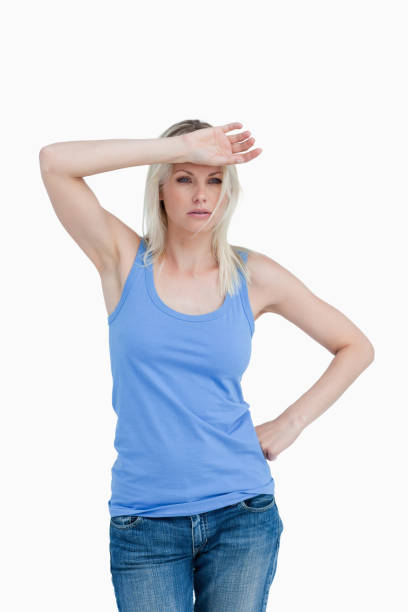 istock Sad blonde woman putting her hand on forehead 825172112