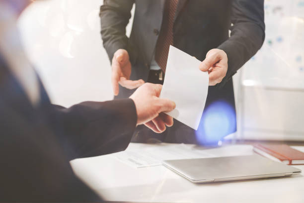istock Credible excellent young man handing a letter 825172738