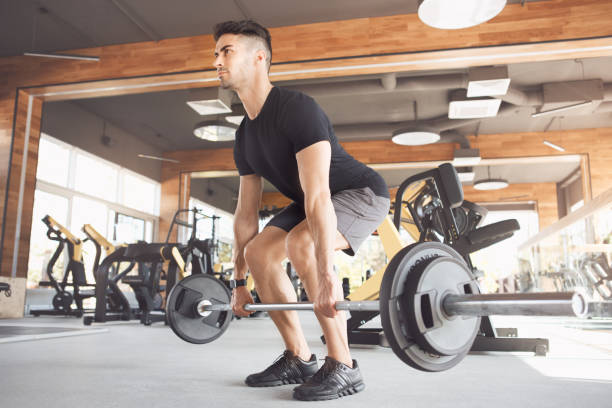 istock Young man exercise in the gym healthy lifestyle 825176660