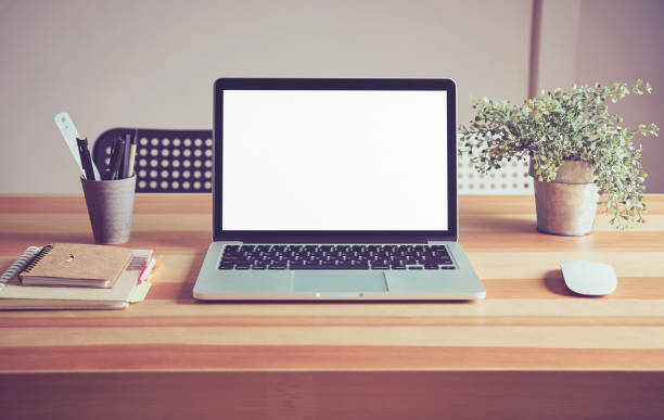 istock Laptop on table in office room background, for graphics display montage. Take your screen to put on advertising. 825180576