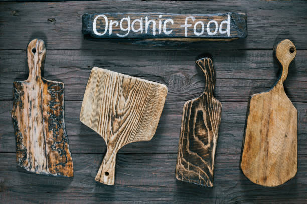 istock Cutting boards over dark wood 825186354