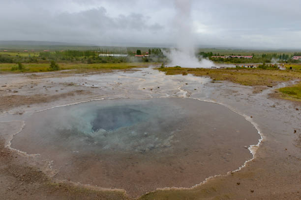 Blood Geyser Spouting and Steaming in a Hillside in the Artists Paintpots in Yellowstone