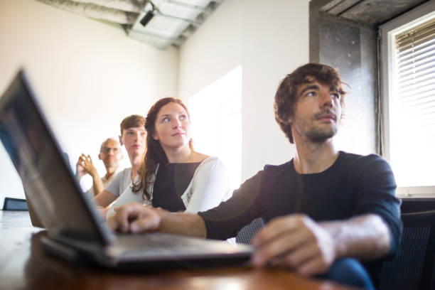 istock Entrepreneurs sitting attentively at a business presentation 825190890