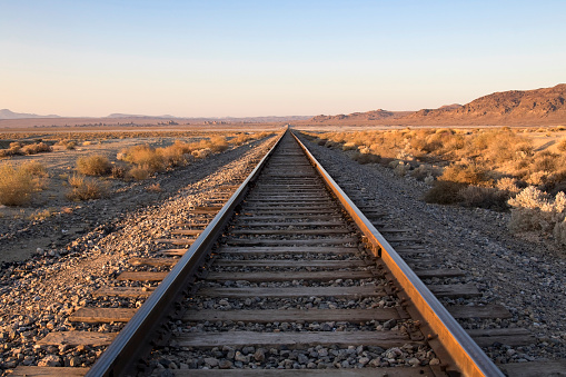 Railroad tracks and crossing in the California desert