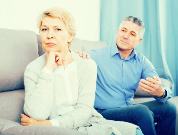 istock resentful mature couple quarreling at home with each other 825199302