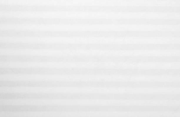 istock White striped pattern on mulberry paper textured background, detail close-up 825203338