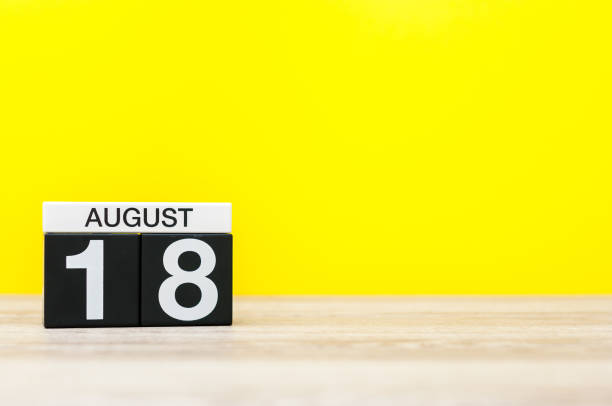 istock August 18th. Image of august 18, calendar on yellow background with empty space for text. Summer time 825208246