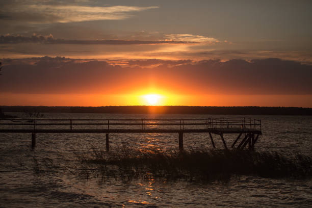 istock Wooden pier at sunset 825208712