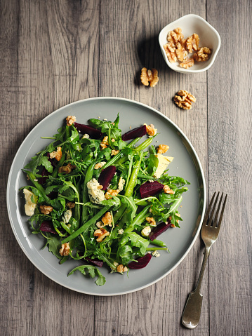 Home made healthy rocket green beans salad with steamed beetroot and blue cheese,walnuts.