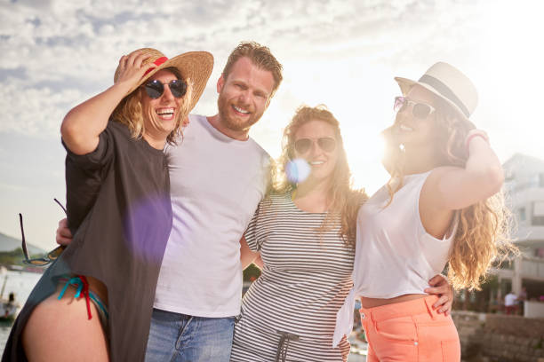 istock Group of people dancing at the beach party 825211138