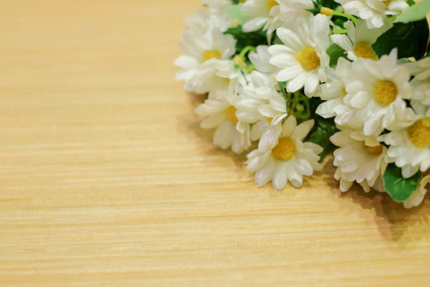 istock Flower on wood backgrounds 825211158