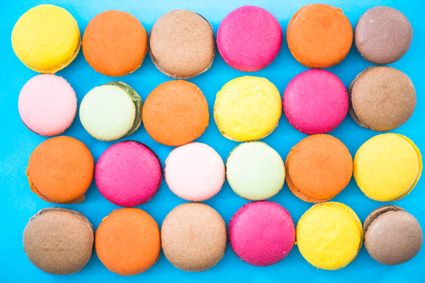 Colorful macaroon cookies, flat lay.