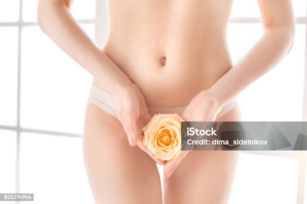 Young Woman Body Care At Home Indoors Stock Photo - Download Image Now - Underwear, Flower, Innocence