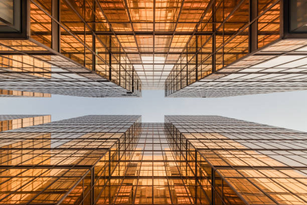 istock Gold colour office building tower facade  in business center 825215280