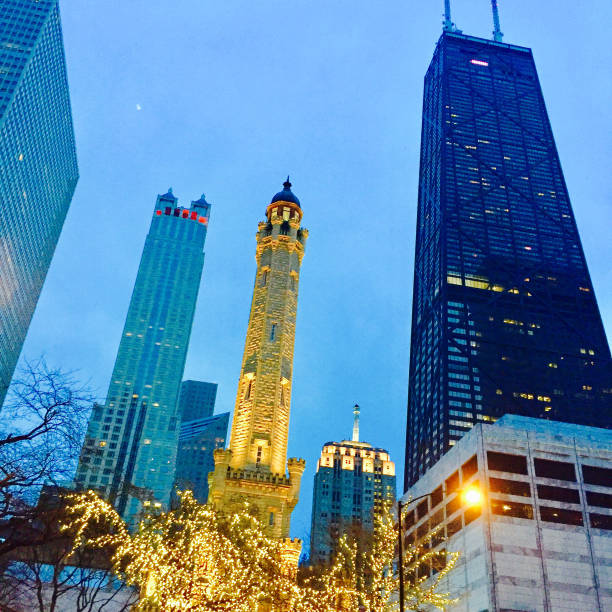 View of Chicago's Water Tower at dusk View of Chicago's Water Tower at dusk water tower chicago landmark stock pictures, royalty-free photos & images