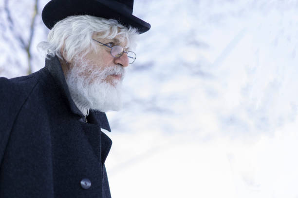 istock Senior side view with old hat on his head and glasses 825216790