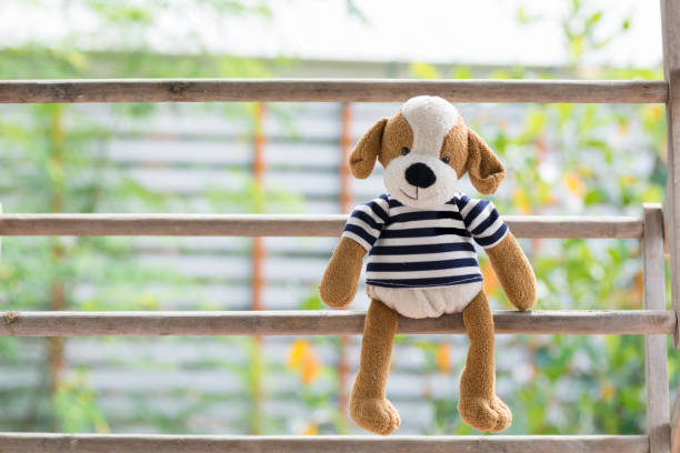 Dog Doll Sitting on a wooden floor