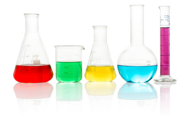 lab glassware filled with colorful liquid laboratory glassware filled with colorful liquid on white background beaker stock pictures, royalty-free photos & images