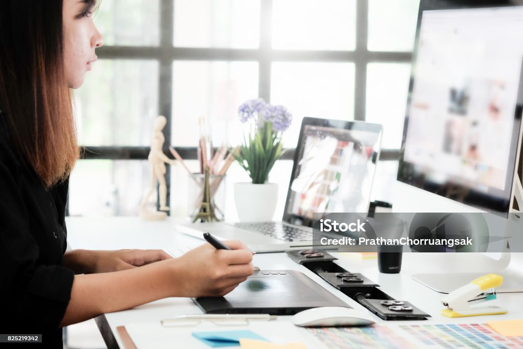 Graphic designer woman working on creative office with create graphic on computer. Graphic Designer Stock Photo