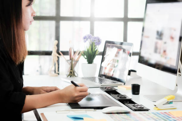 Graphic designer woman working on creative office with create graphic on computer. Graphic designer woman working on creative office with create graphic on computer. illustrator stock pictures, royalty-free photos & images