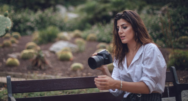 istock Photographer in the public park 825219582
