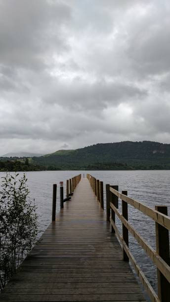 istock Wooden pier leading to a lake 825219762