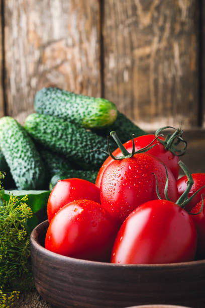 istock Ripe organic cucumbers and tomatoes, preparation for pickling vegetables 825222722